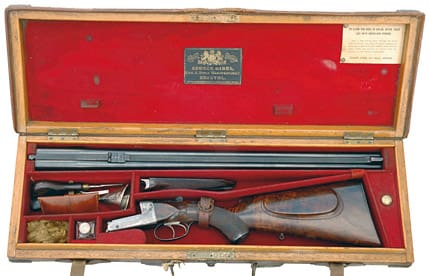 Gibbs-dubbelstudsaren med tillbehör i originalkoffert av ek och läder.
